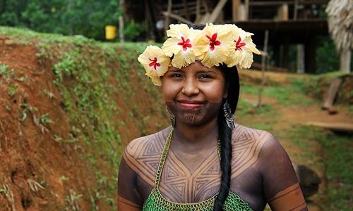 Emberá with traditional temporary paint on her body Emberá with traditional temporary paint on her body