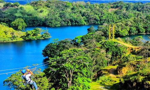 Adventurer Sliding over the Gatun Lake Doing a Zipline Tour in Panama