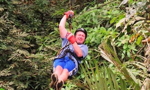 A Man Ziplining in the Anton Valley