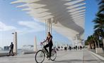 city bike tour girl with her bike, City Bike Tour in Malaga