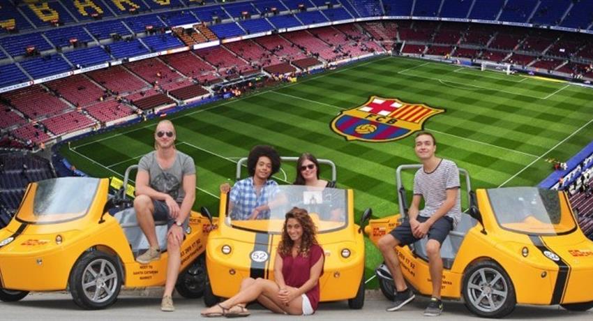 Camp Nou Special group of persons and yellow Go cars, Camp Nou Special Tour