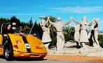 Barcelona Day Tour yellow go car in monument, Barcelona Day Tour